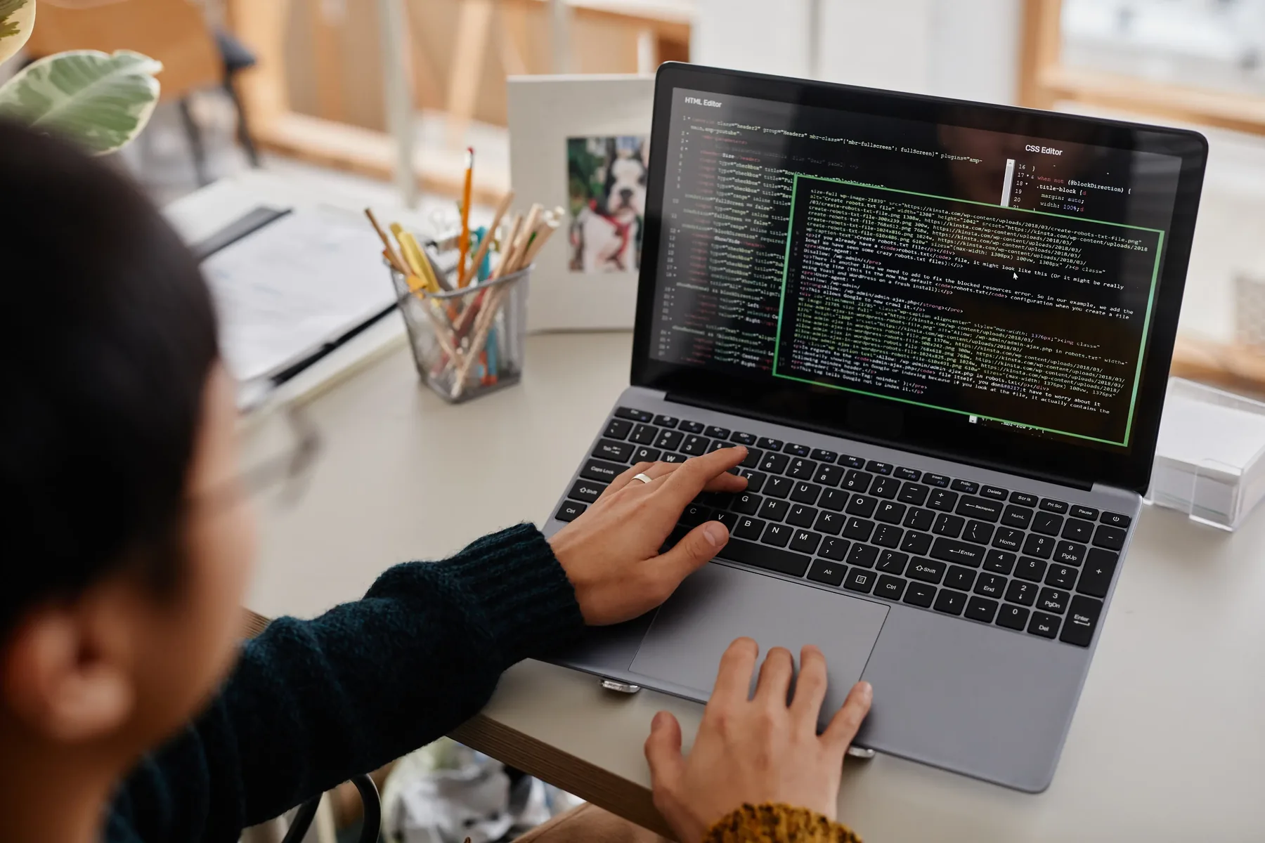 Laptop screen showing code and technical data